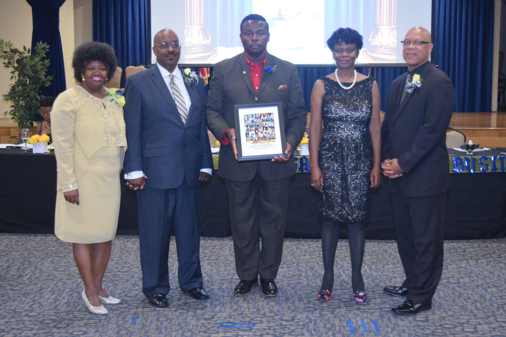 Alban Evans, Sr. accepts a Legend Award for the The Vegetable Man, Aaron's Fruit and Vegetable Stand.